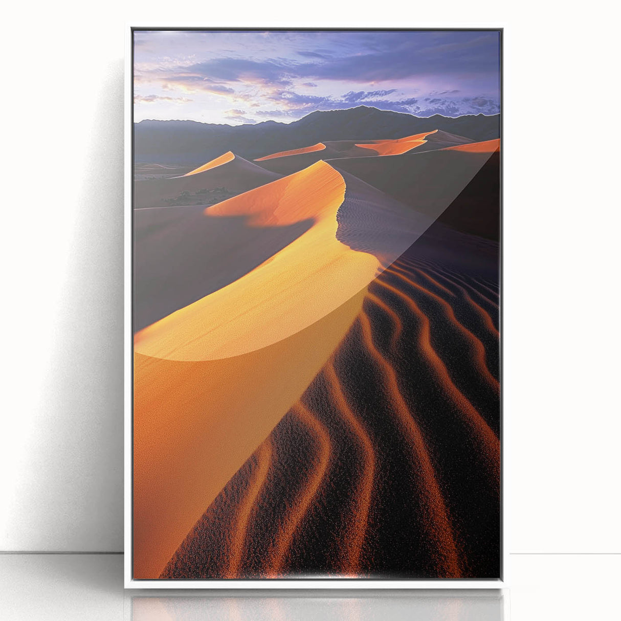 Framed acrylic artwork showcasing serene sand dunes in soft beige and golden tones, elegantly presented in a white frame to enhance modern decor aesthetics.