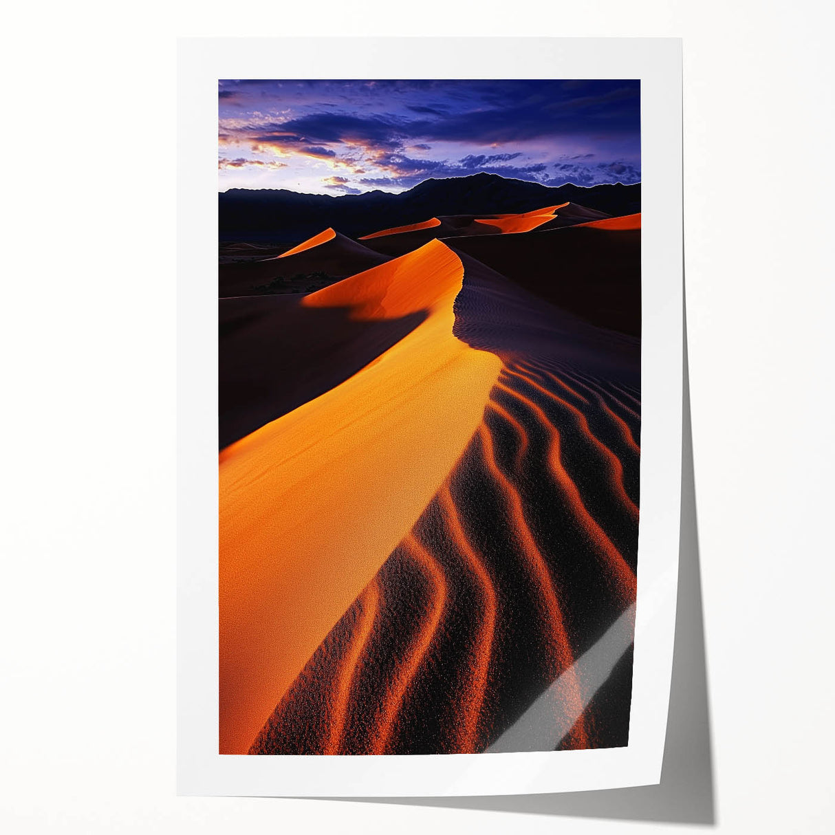 Rolled print showcasing a serene landscape of golden sand dunes under a blue sky, highlighting natural textures and warm colors, perfect for home decor.