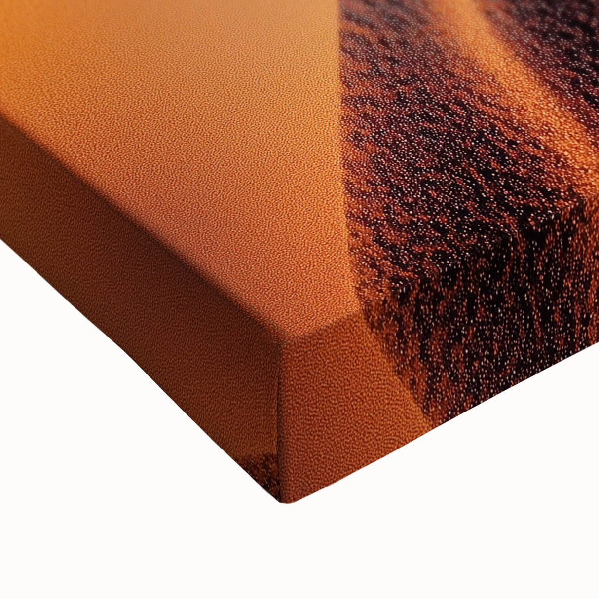 Close-up of a stretched canvas artwork depicting serene sand dunes at sunset, showcasing warm beige and orange tones, perfect for modern home decor.