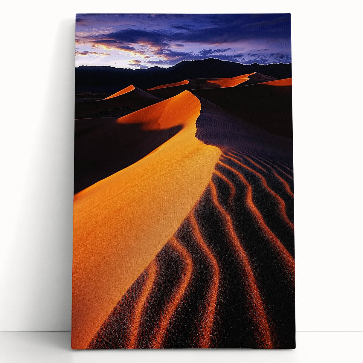 Stretched canvas artwork depicting serene desert dunes under a vibrant sunset, showcasing soft golden hues and intricate textures, perfect for home decor.
