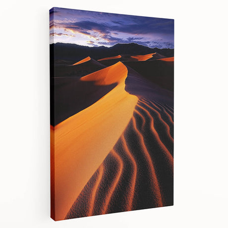 Stretched canvas artwork depicting serene sand dunes under a blue sky, showcasing soft beige and golden tones, ideal for modern home decor or beach-themed interiors.