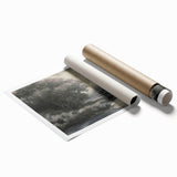 Vibrant rolled landscape print showcasing a serene mountain scene with lush greenery and a clear blue sky, carefully packaged in a protective cardboard tube for shipping.