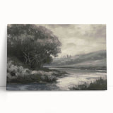Stretched canvas artwork showcasing a vibrant landscape with lush green hills and a serene blue sky, elegantly leaning against a textured wall for display. This visually striking piece adds a touch of natural beauty to any decor, perfect for art enthusiasts and home decorators.