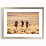 Abstract art print of African scenery in muted earth tones on a framed silver mat, suitable for bedroom or dining room decor.