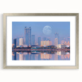 Textured abstract art print of an Indian landscape in muted earth tones, framed in silver, suitable for bedroom decor.