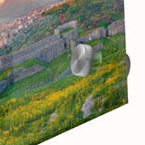 Large abstract wall art depicting a European landscape in muted earth tones on acrylic glass.