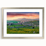 Extra large abstract art print of a textured European scenery in muted earth tones, framed in silver.
