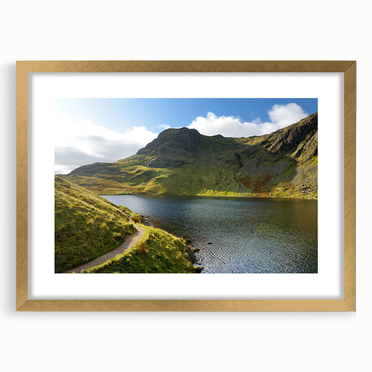 Abstract art print of Cumbrian landscape with muted earth tones on a gold-framed canvas, suitable for dining room decor.