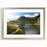 Extra large abstract art print depicting a textured scenery of Cumbria, England in muted earth tones on a framed silver mat.