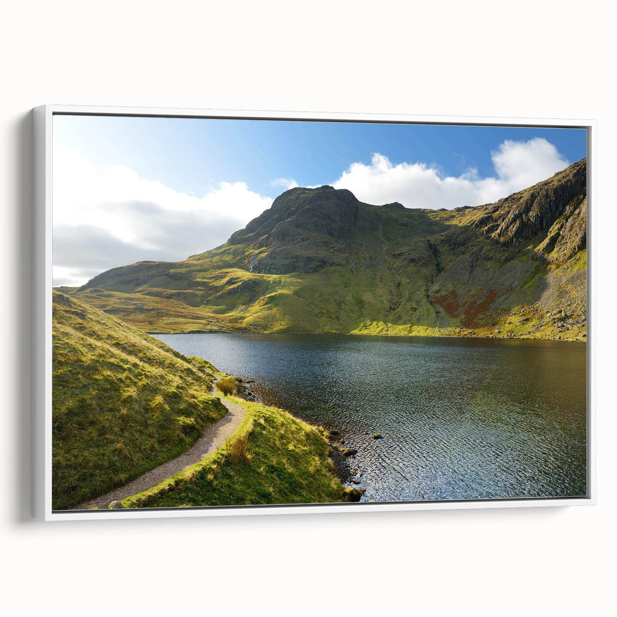 Vintage poster art of Cumbria, England, displayed in a white-framed canvas, featuring colorful imagery.