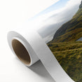 Art deco poster of Cumbria landscape on rolled canvas, featuring muted green and blue tones, ideal for nursery wall art.