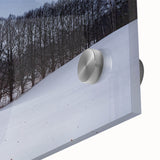 Large abstract wall art of a European cityscape in muted gray and blue tones on acrylic glass.