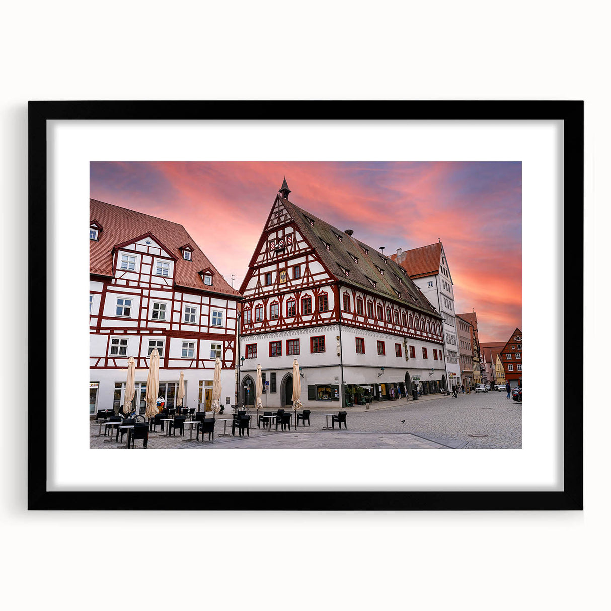 Extra large abstract art print of a colorful Bavarian scenery on textured canvas, framed in black.
