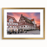 Abstract art print of a Bavarian landscape in muted earth tones, framed in gold, suitable for dining room decor.