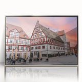 Large art print of a Bavarian landscape in muted green and blue tones, framed in silver acrylic.