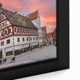 Framed canvas of a Bavarian landscape in textured black with colorful accents, ideal for large living room walls.