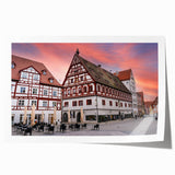 Scenic Bavarian landscape print on rolled canvas, featuring lush greenery and soft blue skies.