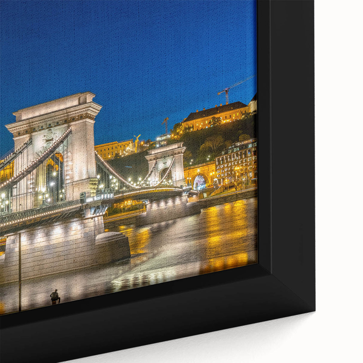 Extra large framed canvas featuring a textured depiction of a European cityscape in black with colorful accents.
