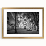 Abstract art print of Barcelona skyline in muted gold and blue tones on a framed canvas, suitable for dining room decor.