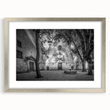 Extra large abstract art print of Barcelona skyline in textured tones of gray and silver, framed with a matte silver finish.