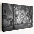 Side view of a stretched canvas depicting a scenic Barcelona landscape, featuring warm earth tones.