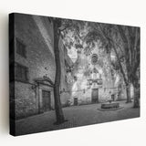 Side view of a stretched canvas depicting a scenic Barcelona landscape, featuring warm earth tones.