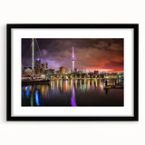 Colorful abstract art print of Auckland scenery on textured canvas, framed in black, ideal for living room decor.