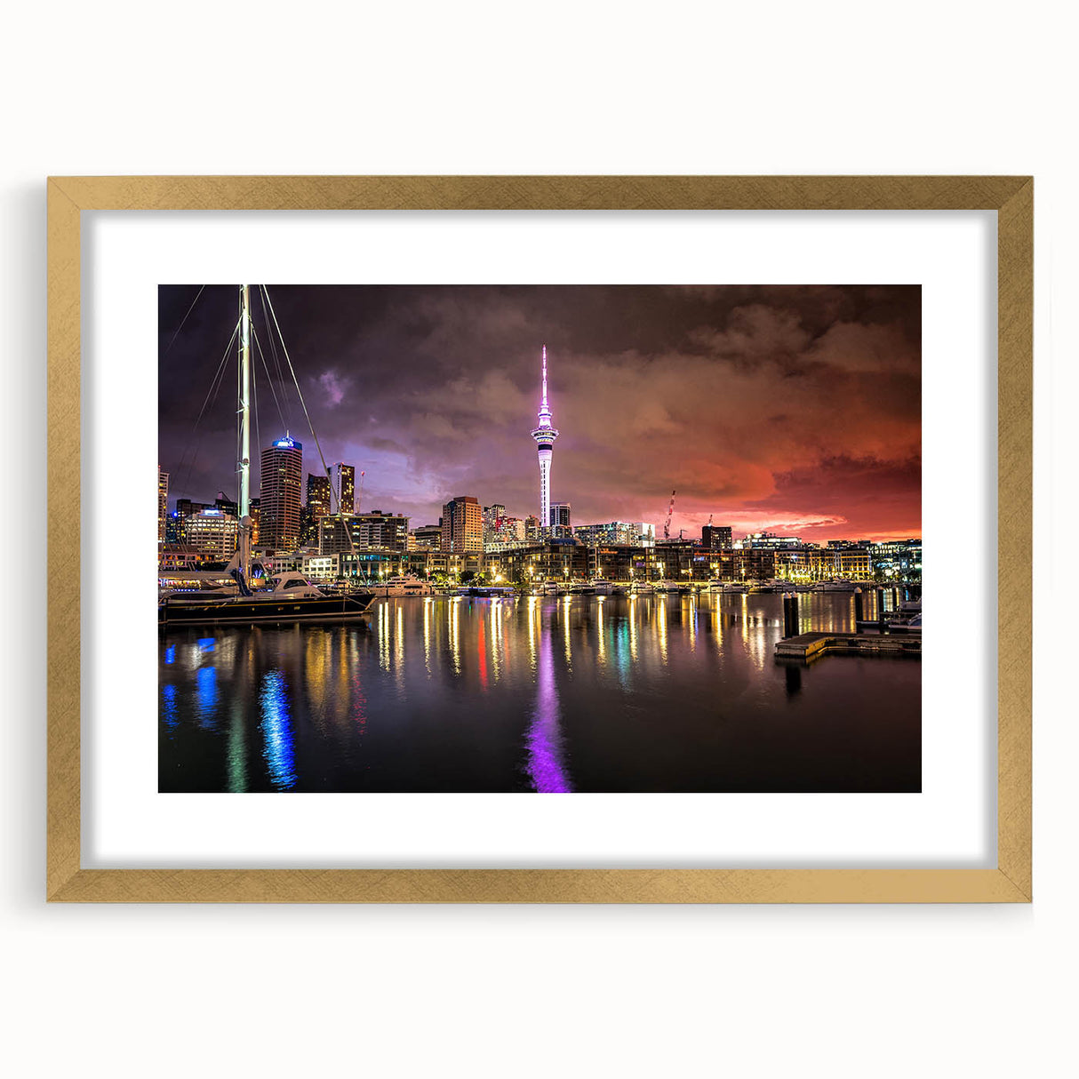 Abstract art print of Auckland skyline in muted gray and blue tones on a gold-framed canvas, ideal for living room decor.