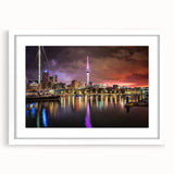 Abstract art print of Auckland skyline in muted blue tones on a white framed canvas, suitable for dining room decor.