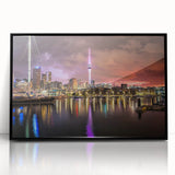 Large abstract wall art of Auckland skyline in muted gray and blue tones on a black framed acrylic.