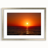 Textured abstract art print of a vibrant, multicolored landscape on a silver-framed mat, ideal for bedroom art.