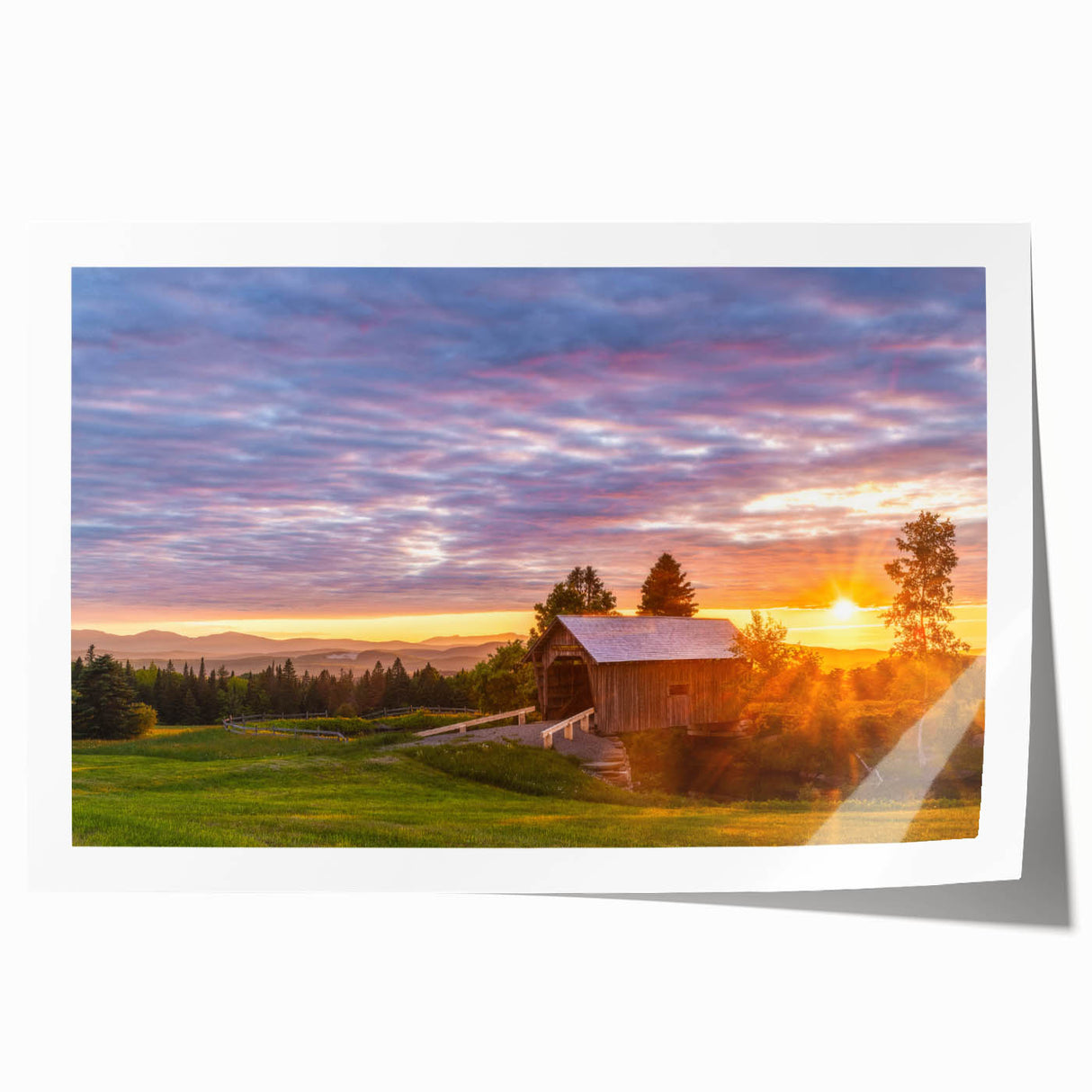 Scenic Vermont landscape on rolled canvas, featuring lush green foliage and soft blue skies.