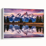 Vintage poster art of the Grand Tetons in Wyoming on a framed canvas, featuring muted earth tones.