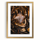 Extra large abstract art print depicting textured fall foliage in gold frame, suited for living room decor.