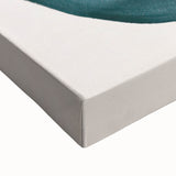 Close-up of an abstract minimalist wall art design on stretched canvas, showcasing soft earth tones and fluid shapes, perfect for modern home decor.