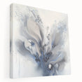 Stretched canvas artwork showcasing vibrant abstract florals in rich hues of blue, pink, and gold, designed to enhance modern home decor with artistic flair.