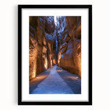 Framed landscape art print showcasing a serene cave scene with vivid colors, set in a sleek black frame, ideal for home decor and interior design enhancement.