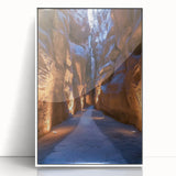 Framed acrylic landscape artwork showcasing a serene cave scene, featuring earthy tones and intricate details, set in a sleek white frame for modern decor. Ideal for enhancing living spaces with a touch of nature-inspired elegance.