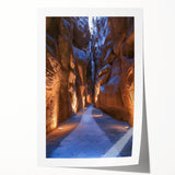 Vibrant landscape artwork depicting a serene cave scene with rich earthy tones, rolled and ready for display, showcasing intricate textures and details.