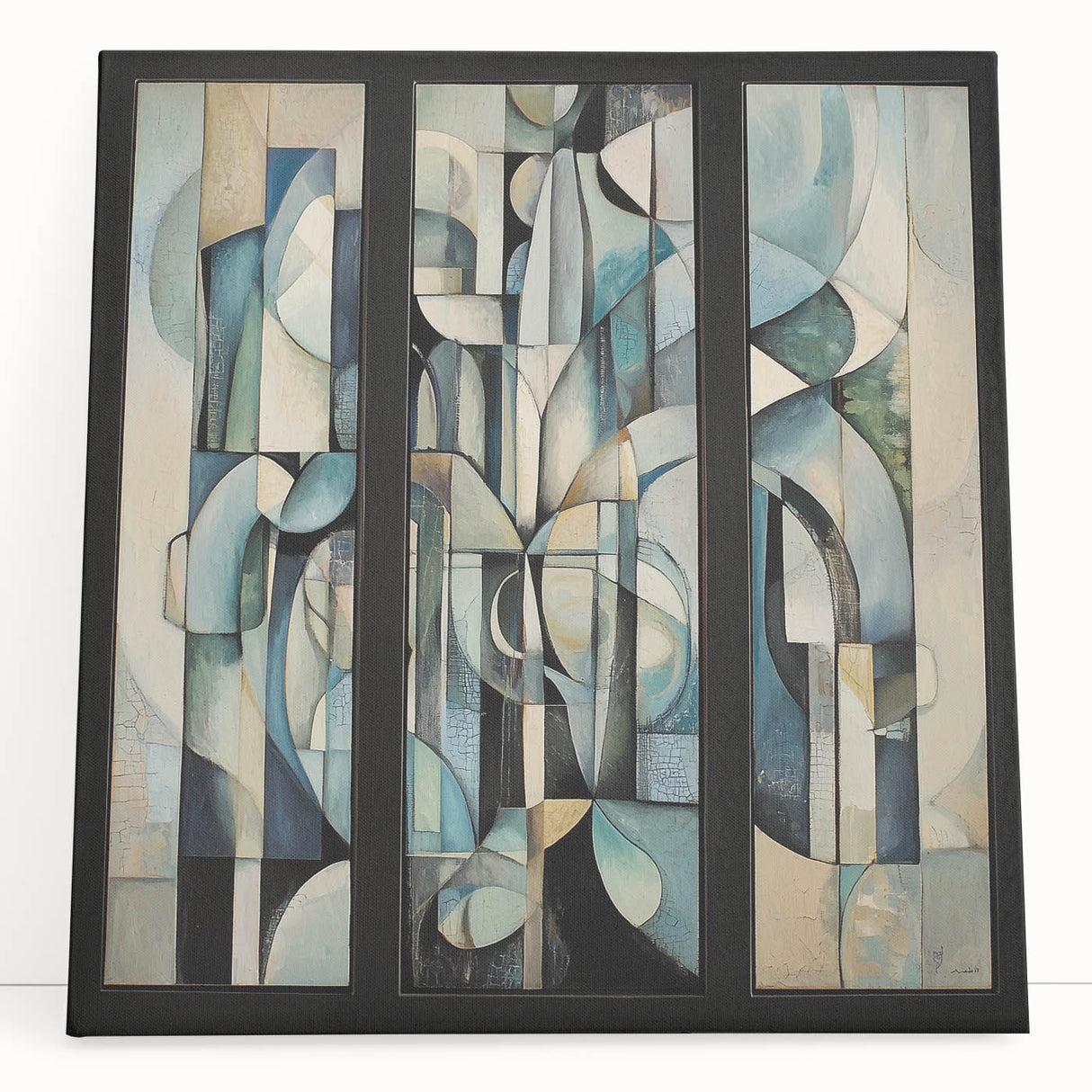 Abstract geometric stretched canvas artwork showcasing vibrant colors, including blues and oranges, leaning against a wall, perfect for modern home decor.