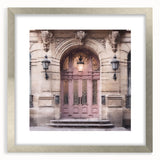 Textured abstract art print of a French door, rendered in muted gray and white, framed with a silver mat.