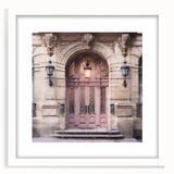 Abstract art print of a French door architecture, in muted gray tones on a white framed poster.