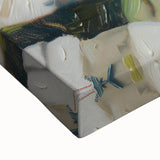 Close-up of a large art piece featuring black and white landscape paintings of pastries on stretched canvas.