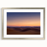 Framed desert landscape artwork in a silver mat, showcasing vibrant colors and intricate details, perfect for home decor or office spaces.