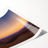 Desert landscape art print showcasing vibrant hues of orange and yellow, rolled and ready for display, capturing the essence of arid beauty in a durable tube.