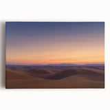 Stretched canvas artwork depicting a vast desert landscape, showcasing vibrant orange and yellow hues under a bright blue sky, ideal for home decor and art lovers.