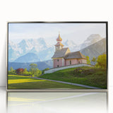 Large art print of a serene Austrian landscape in muted greens and blues, framed in silver acrylic.