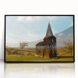 Large abstract wall art depicting a European cityscape in muted gray and blue tones, framed in black acrylic.