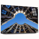 Acrylic glass print of a large abstract depiction of Barcelona, featuring vibrant, varied hues, ideal for dining room decor.