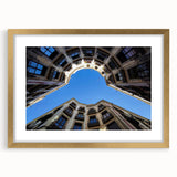 Abstract art print of Barcelona scenery in muted earth tones on a framed canvas, suitable for dining room decor.